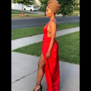 Red floor length wrap dress.